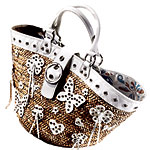 Straw bag with leather and grommet accents, Rafe.