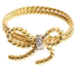 Twisted 18kt-yellow-gold ring with .02-carat diamond, Vera Wang.
