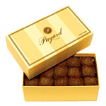 Hand-cut and gold-dusted Krug champagne truffles, Payard.