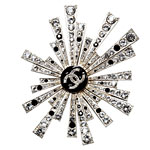 Metal-and-resin brooch, Chanel.