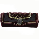 Clutch with metal details, Yves Saint Laurent.