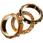Bangles of bone and brass or leather, Gara Danielle.