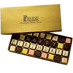 Hand-decorated petits fours, in raspberry parfait, mocha and more, Divine Delights.