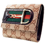 Leather-trimmed canvas wallet with silver horse-bit closure, Gucci.