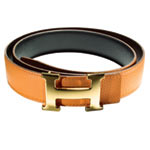 Orange leather belt (in five other colors) with gold-plated buckle, 