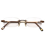 Rimless eyeglasses with metallic bronze, Brooks Brothers.