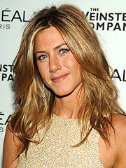 Aniston Sues Photog Over Topless Pics