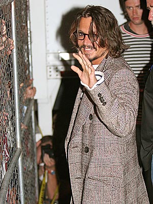 ON THE FENCE? photo | Johnny Depp