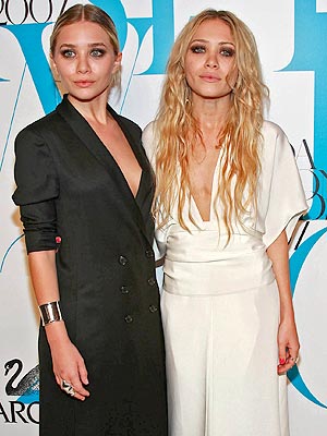 Which was the first to land the cover of a national magazine cover without her sis? | Ashley Olsen, Mary-Kate Olsen