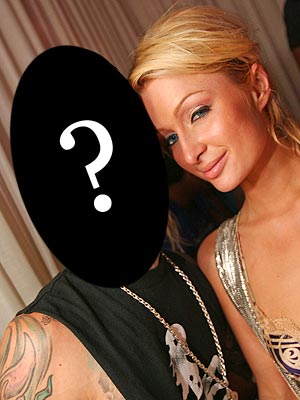 Paris and a fellow reality-TV star had a dustup after the heiress was caught kissing which musician?