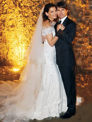 Which designer outfitted the bride and groom for their Nov. 18 Italian wedding? | Katie Holmes, Tom Cruise