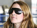 Drew Takes Cover (and Takes Off) at LAX | Drew Barrymore