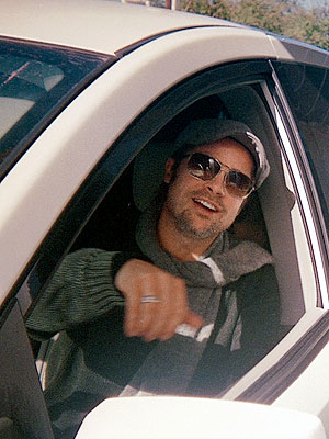 During the filming of Ocean's Twelve, notorious prankster George Clooney put unflattering bumper stickers on pal Brad Pitt's car. What did they say? | Brad Pitt