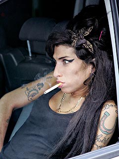 English singer, songwriter and drug addict Amy Jade Winehouse smoking in the car.