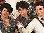 Ho Ho Ho! The Jonas Brothers Gather Round the Tree!