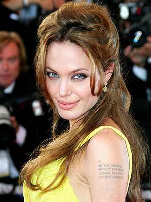 angelina jolie tattoos on back. The actress has a tiger tattoo