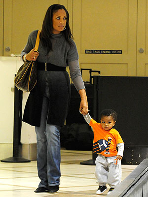 laila ali baby. Laila Ali and CJ Touch Down