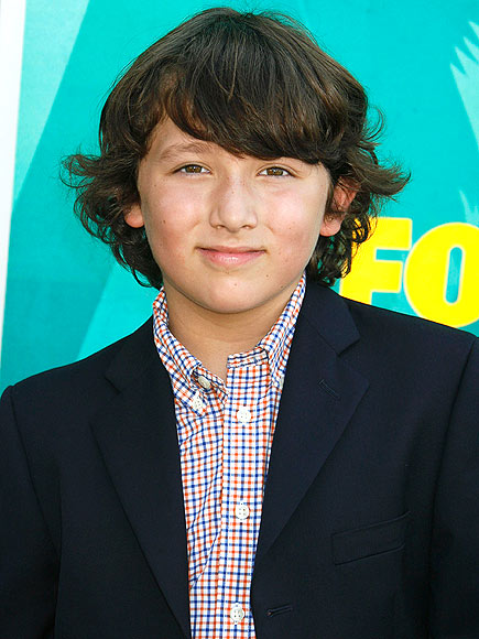 Fans of this 9-year-old's older siblings love him so much, they've given him a nickname. Who are his famous relatives?