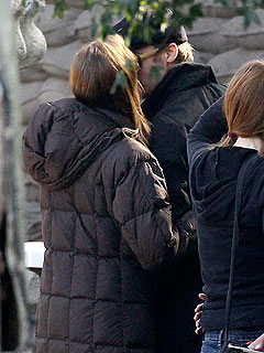 Buss-ted: Angelina Jolie and Brad Pitt Steal a Kiss on Set