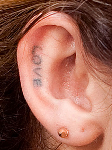 What teen star sports this ear tattoo? | Miley Cyrus