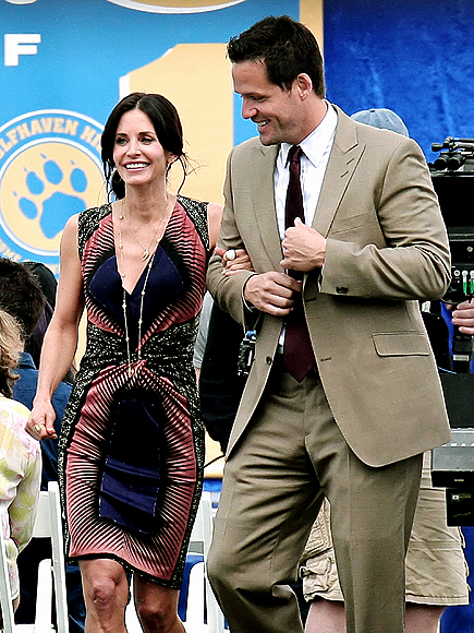 ARM CANDY photo | Courteney Cox