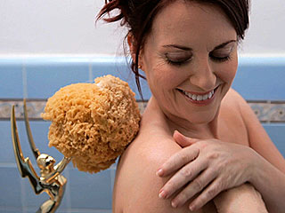 VIDEO: Megan Mullally Showers with Her Emmys | Megan Mullally