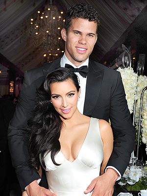 Kim Kardashian and Kris Humphries at their wedding Albert Michael Startraks