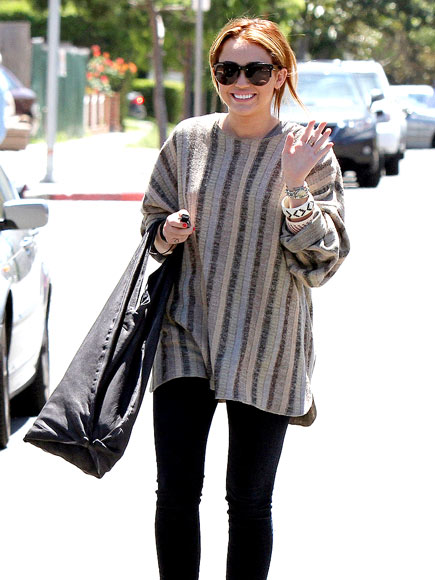 SHOW OF HANDS photo | Miley Cyrus