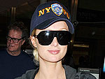 Paris Hilton Rummages Through Her Bags at JFK