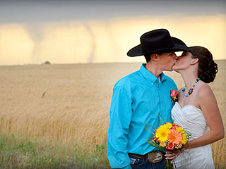 PHOTO: Newlyweds Smooch – with Tornadoes in the Background