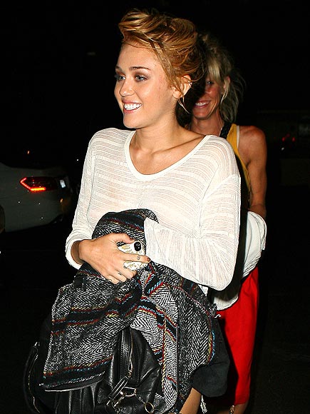UNDER WRAPS photo | Miley Cyrus