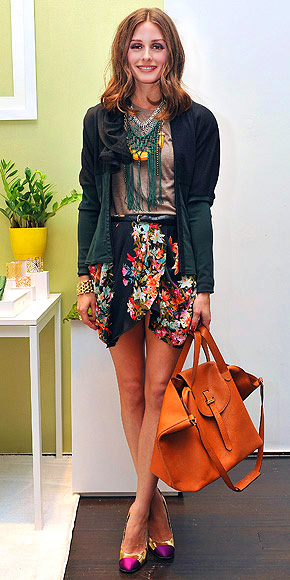 Olivia Palermo accessorizes with ease, pairing her tulip skirt, puff-sleeve jacket and pretty pumps with layered necklaces. Which piece is under $100? | Olivia Palermo