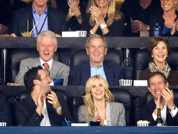 Presidents Bill Clinton and George W. Bush Catch the NCAA College Basketball Finals Together