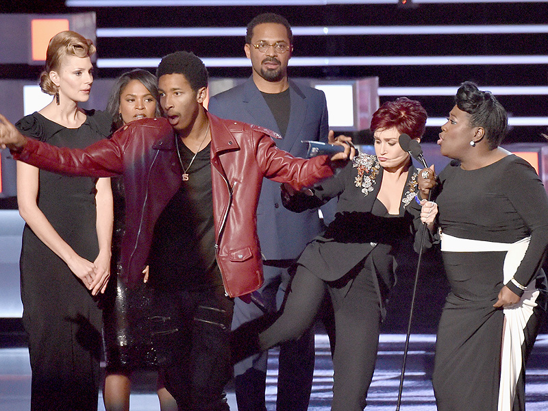 Watch Sharon Osbourne Give the Boot to a Serial Party Crasher Who Tried to Steal the Show at People's Choice Awards| People's Choice Awards, Kanye West, Sharon Osbourne
