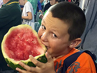 VIDEO: This Kid Eating an Entire Watermelon at a Cricket Game is the First Internet Hero of 2016