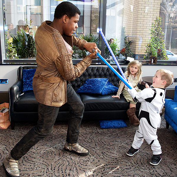 Cute Alert! John Boyega Surprises Sick Children with Star Wars Toys| Star Wars, Real People Stories, John Boyega