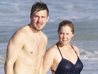 Amy Schumer and Ben Hanisch Take a Dip in the Ocean While Celebrating Their Six Month Anniversary in Hawaii