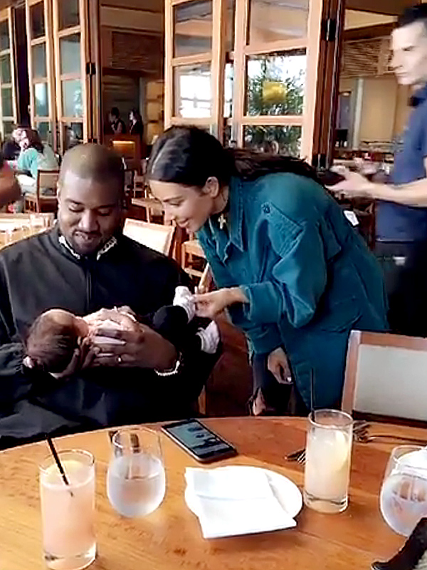Kim Kardashian and Kanye West with Luna