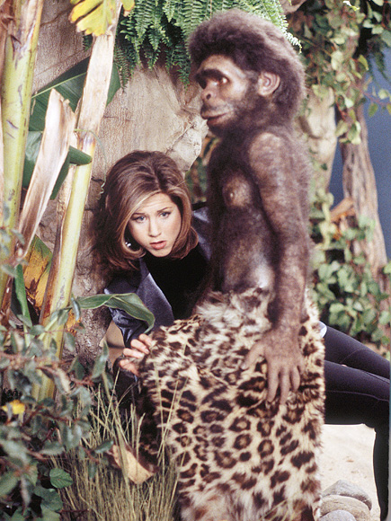We just really like this picture of Aniston with a caveman diorama in a museum.