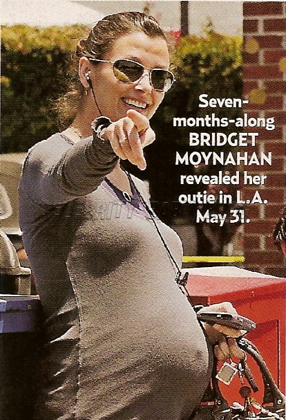 Bridget Moynahan listens to some tunes as she smiles and points at the 