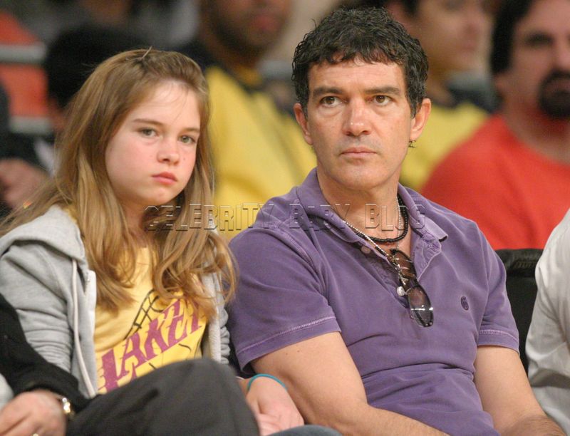 Antonio Banderas and Stella sit sidelines at Lakers game