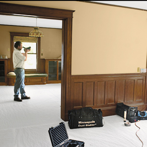 man investigating draft using camera 