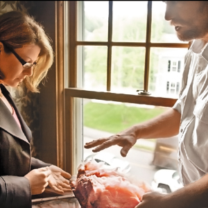 two people examining fiberglass
