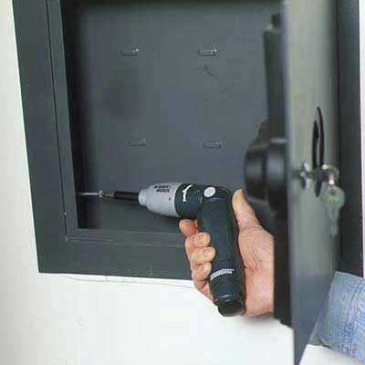 Secure the safe to the wall with screws.