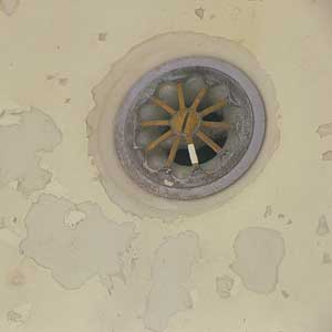 damaged tub finish near drain
