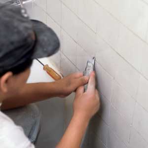 scraping tub tile joints
