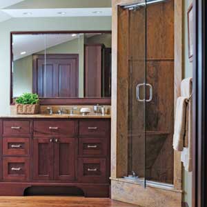 Husband's bathroom with limestone-lined steam shower