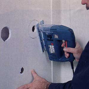 enlarging the existing faucet holes