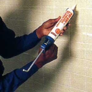 applying silicone adhesive to ceramic tile