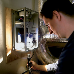 fiber-optic cables attached to a fan-cooled box at the Watertown house